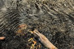 Photo of reflections seen in fast running stream